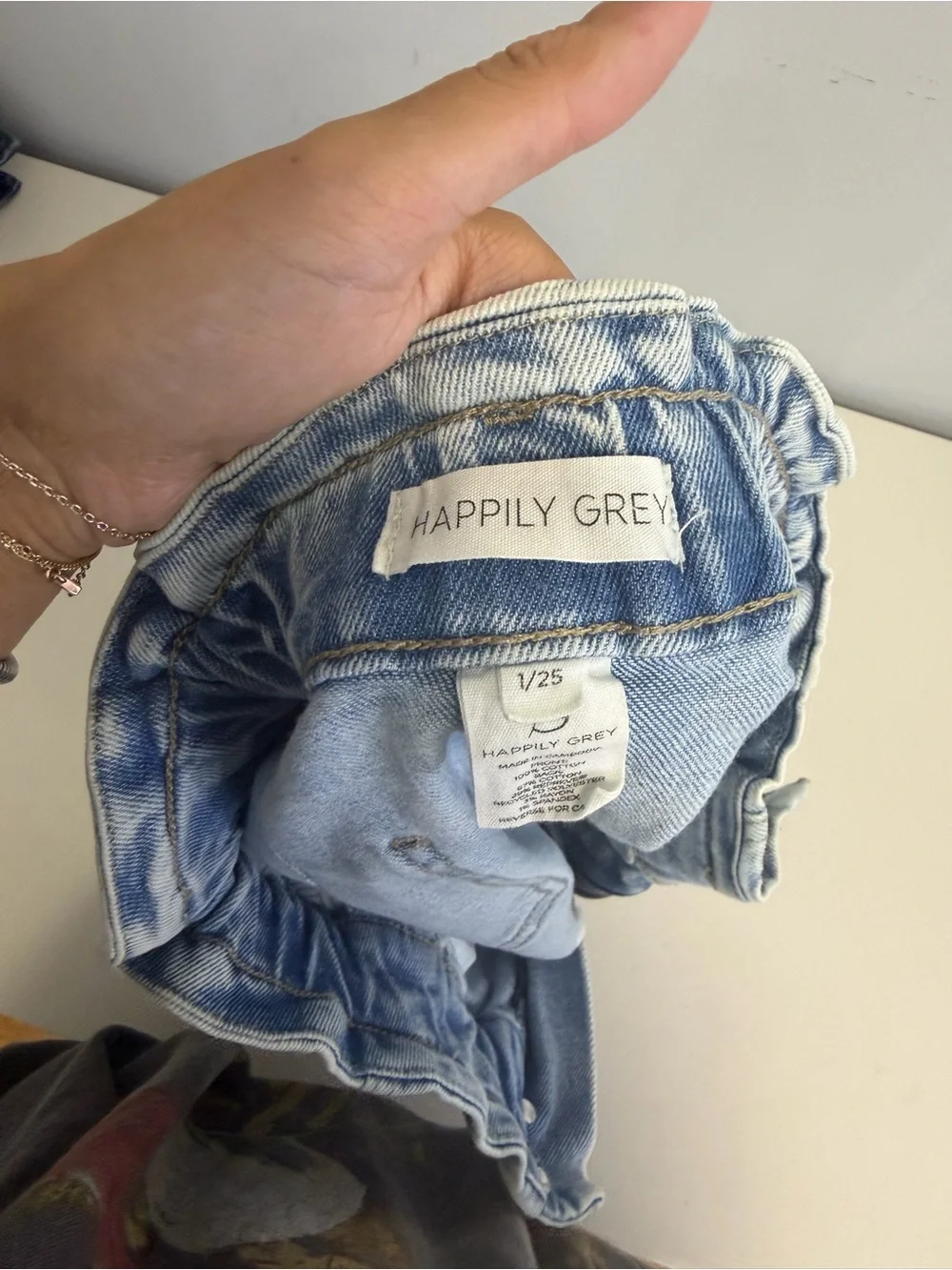 High-Rise Light Blue Paperbag Denim Shorts with Distressed Hem